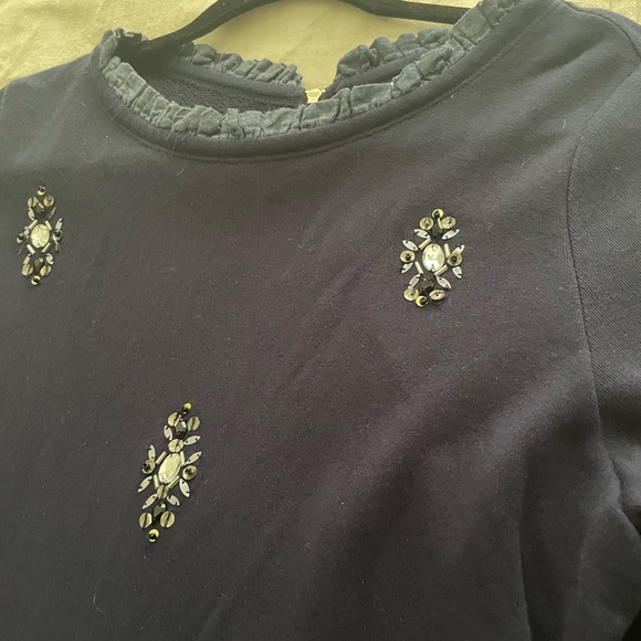 Soft dressy with feminine ruffles and stones. - Picture 2 of 4